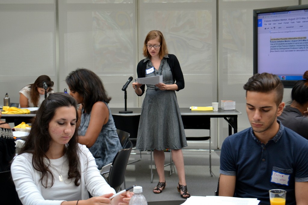 Hilarie Ashton leads the Mentors in exploding the text, where each person voices their response to the poem "The Rose That Grew From Concrete"